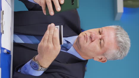Vertical-video-of-Businessman-shopping-on-the-phone.